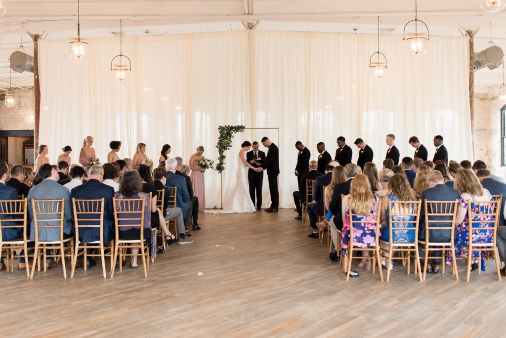 indoor wedding ceremony with drapery at The Cedar Room