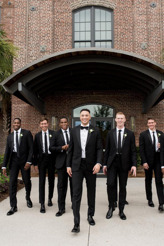 groom and groomsmen in black suits at The Cedar Room