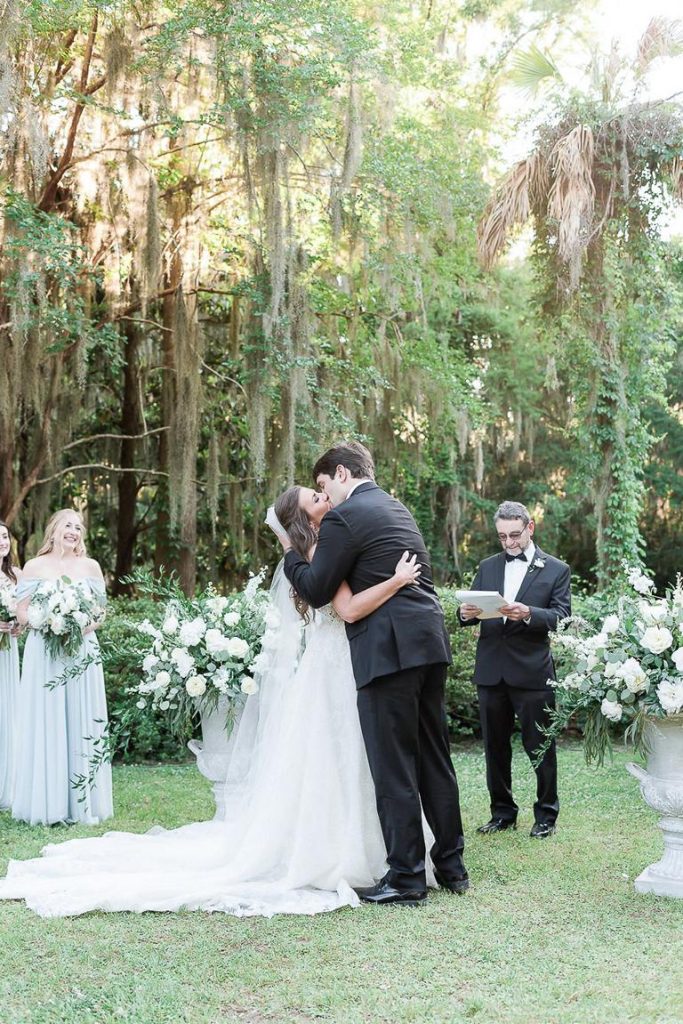 couple kiss at their wedding ceremony