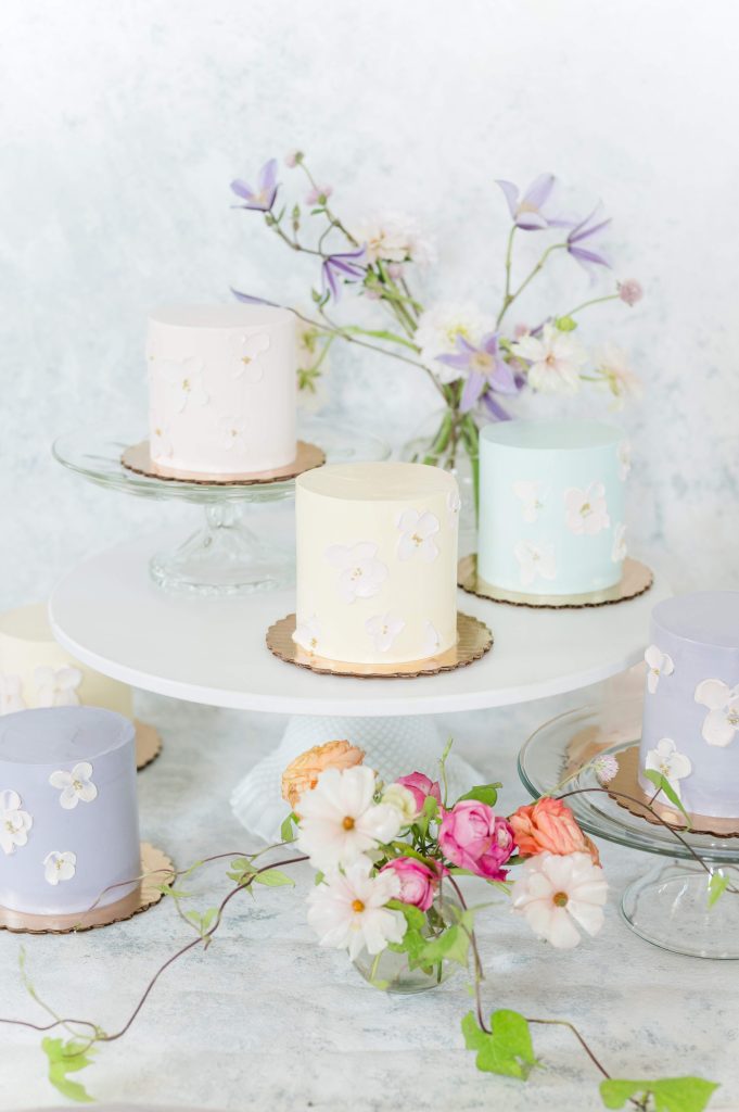six mini pastel wedding cake display