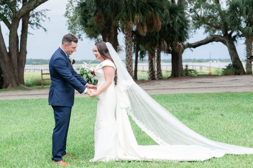 Bride and groom have first look on Lowndes Grove lawn