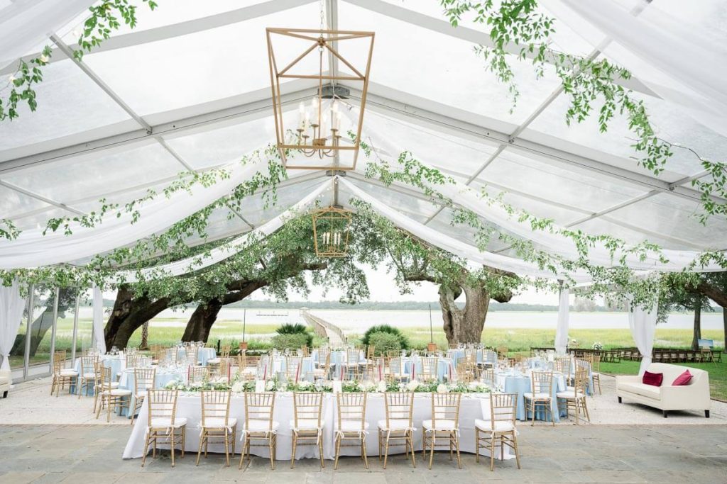 Inside of clear tented outdoor wedding reception