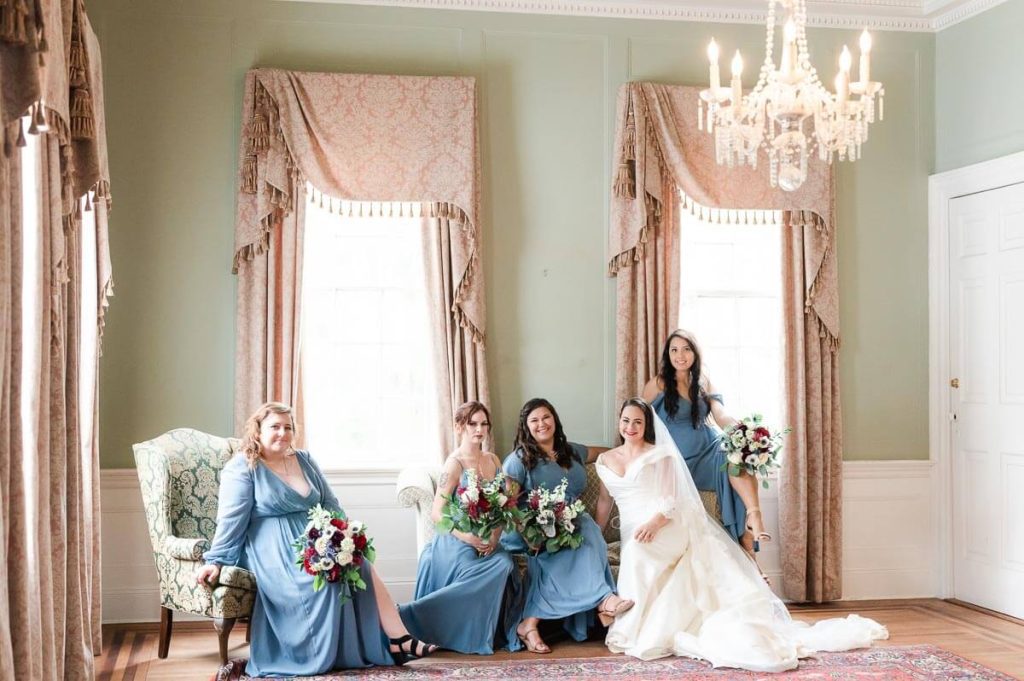 bridal party sitting down on couch and chair