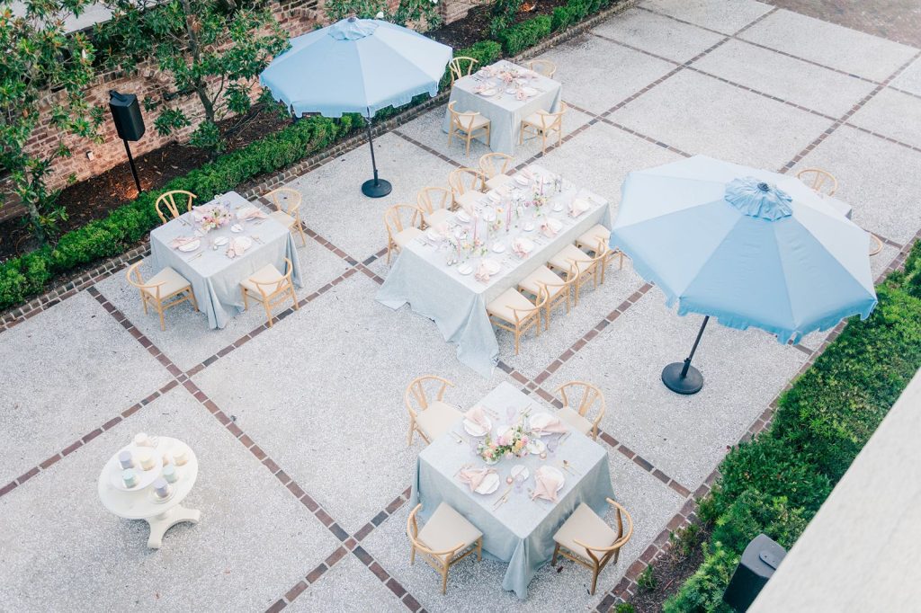 overview of outdoor wedding reception setup on oyster tabby patio