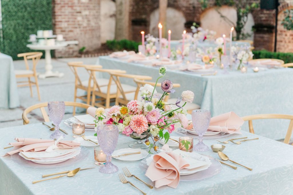 close up of wedding reception table set up with pastel color palette