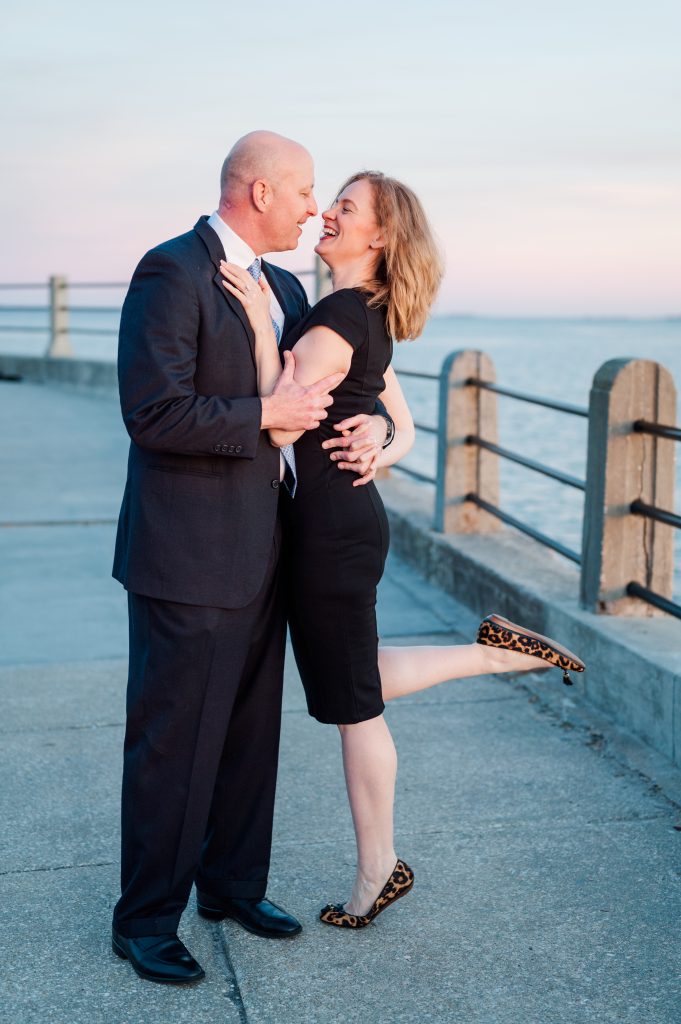 couple embrace after proposal on Battery in Charleston, SC