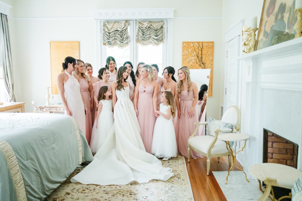 bridal party has first look with bride on her wedding day inside historic home