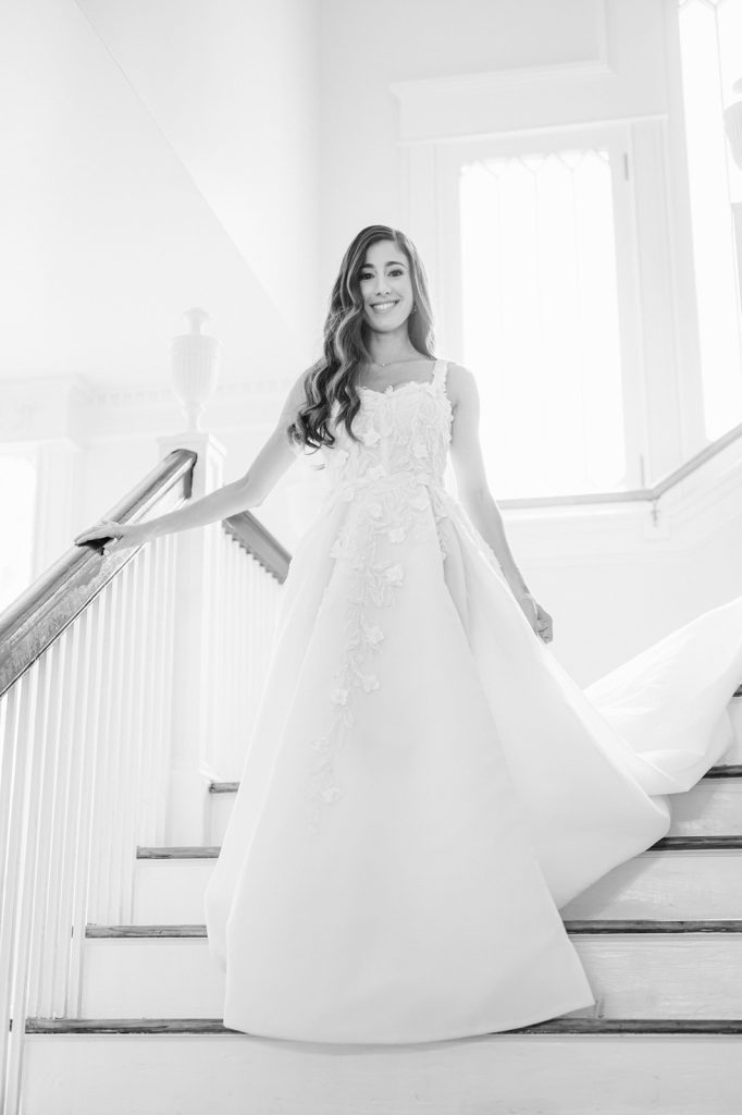 bride walking downstairs on her wedding day