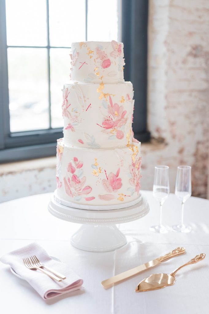 Pastel and gold leafed three tiered wedding cake
