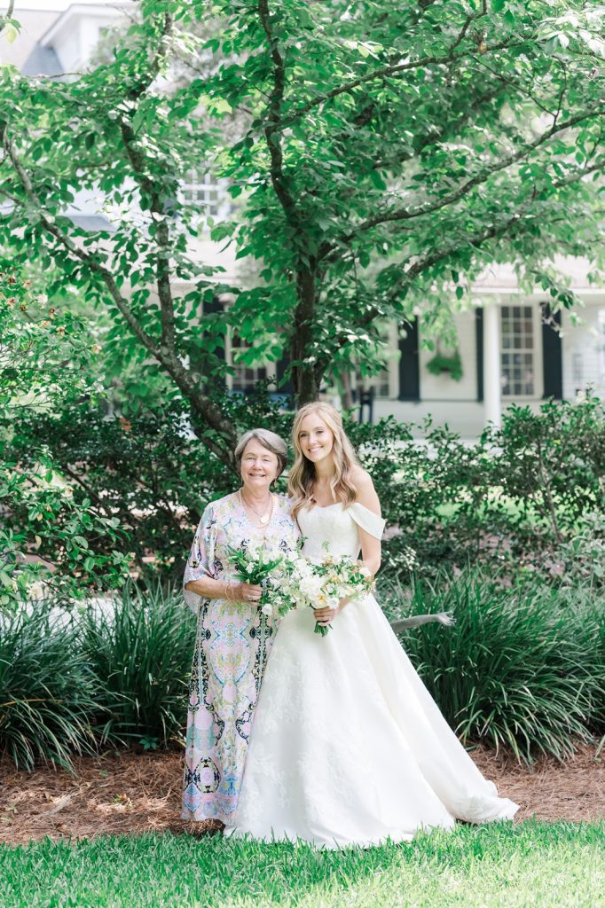 mother and bride pose for a full length portrait