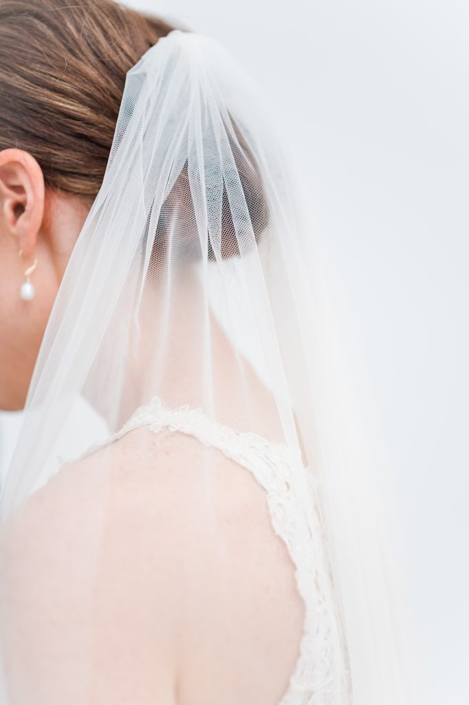 close up of back of bride's hair, shoulder and veil