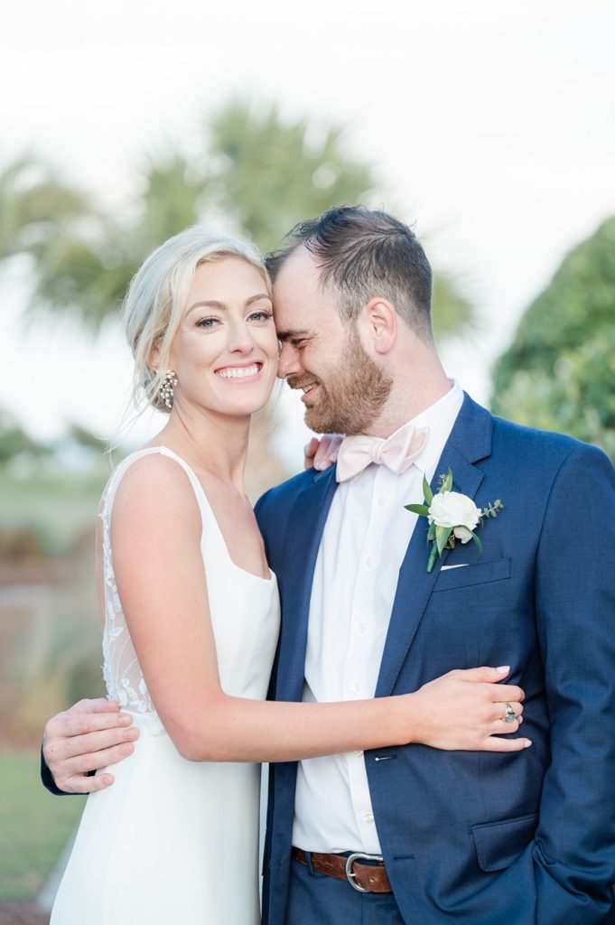 groom nuzzling his new bride