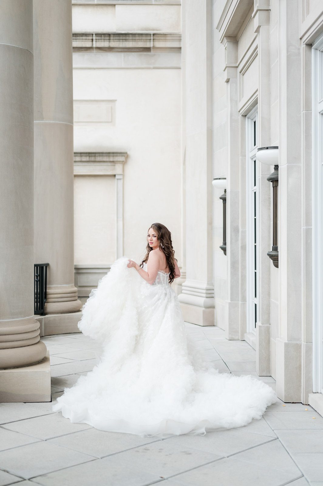 bride walking away from camera looking over shoulder
