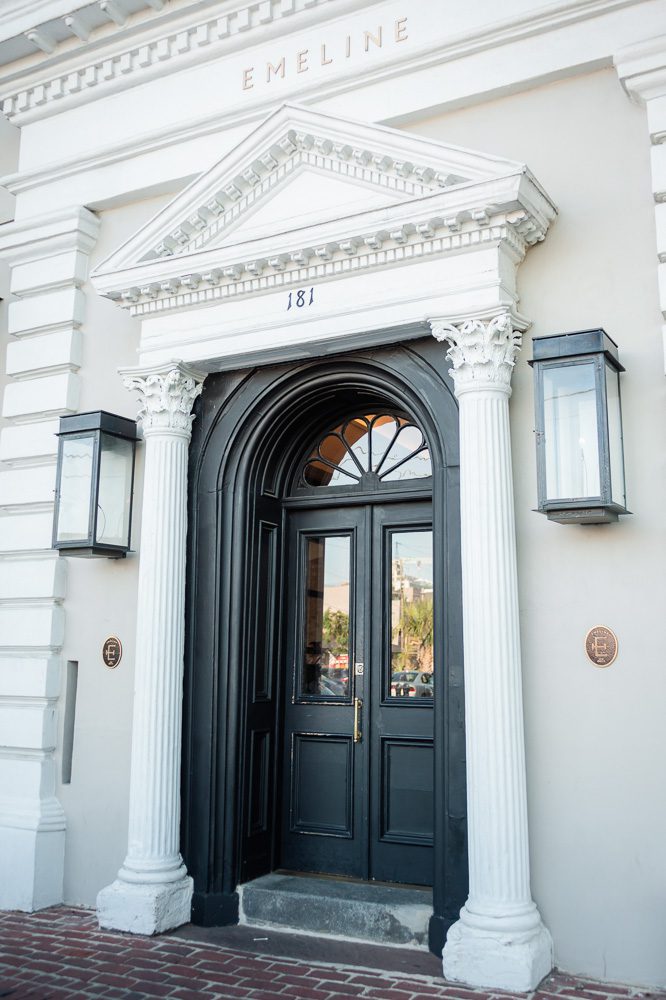 Black exterior entrance door of Hotel Emeline
