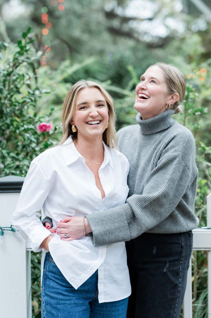 two women hug each other after getting engaged