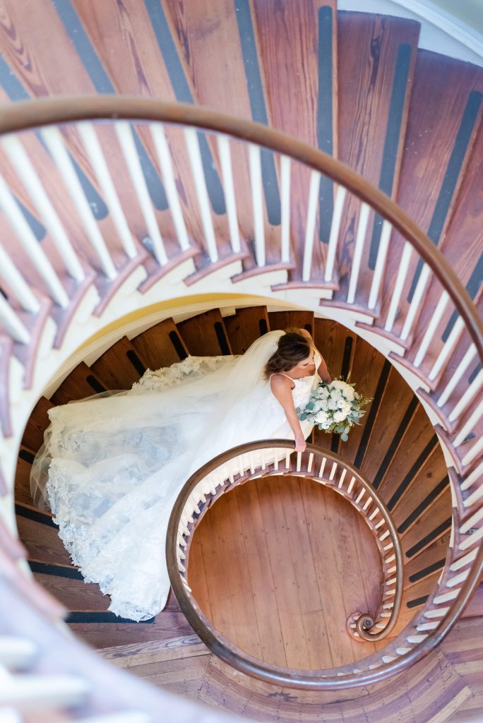 bride walking down spiral staircase
