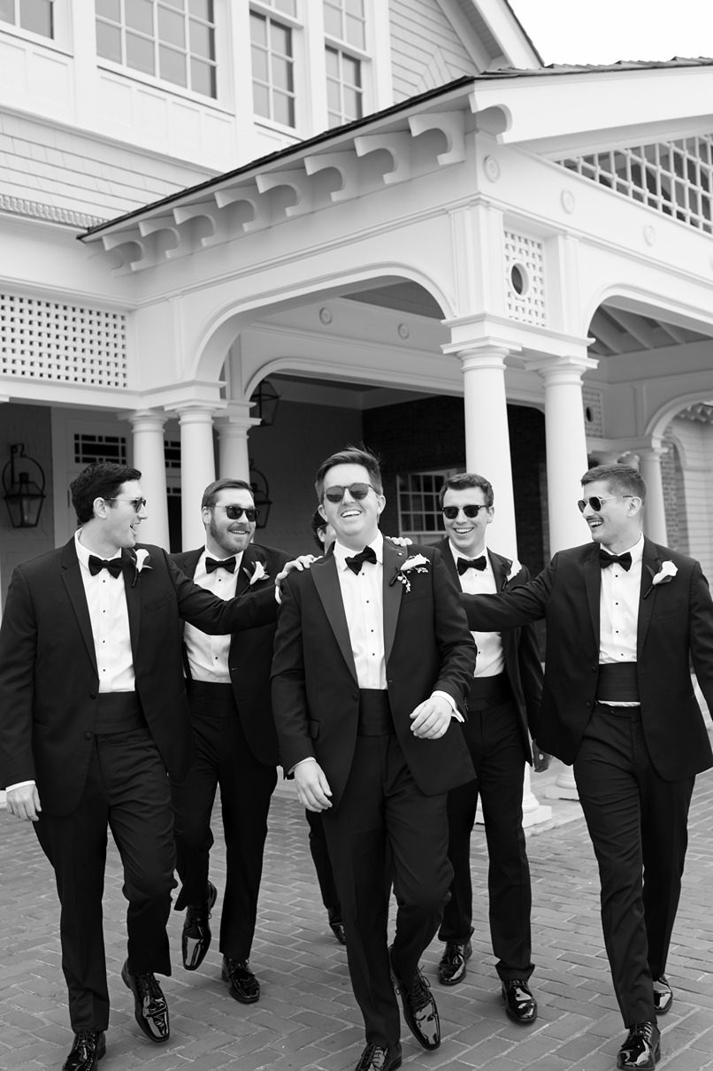 groomsmen walking with sunglasses