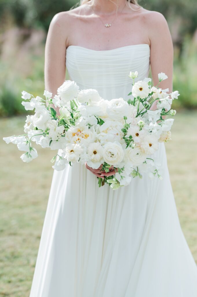 white bridal bouquet held by bride