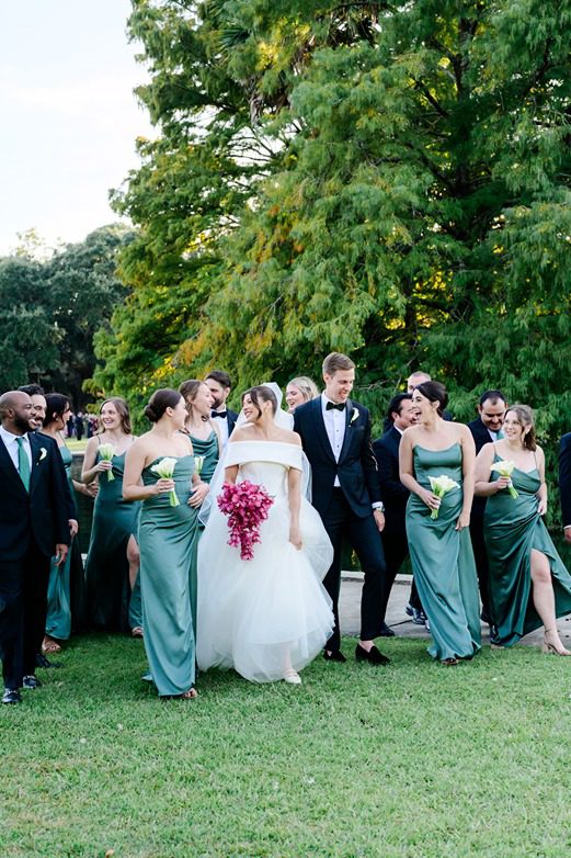 bridal party walking and talking in Hampton Park