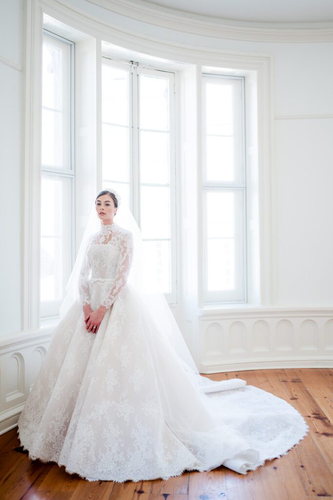 Bridal portrait in long sleeve lace wedding dress at La Banquette Charleston SC