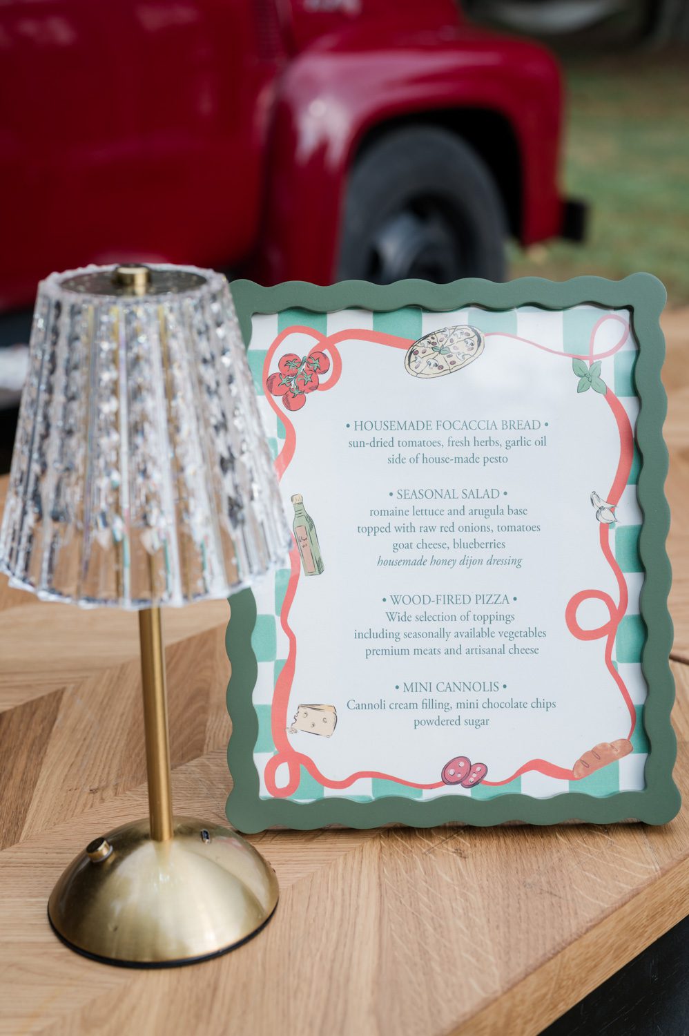 Elegant rehearsal dinner menu sign displayed during a multi-day wedding weekend at Middleton Place