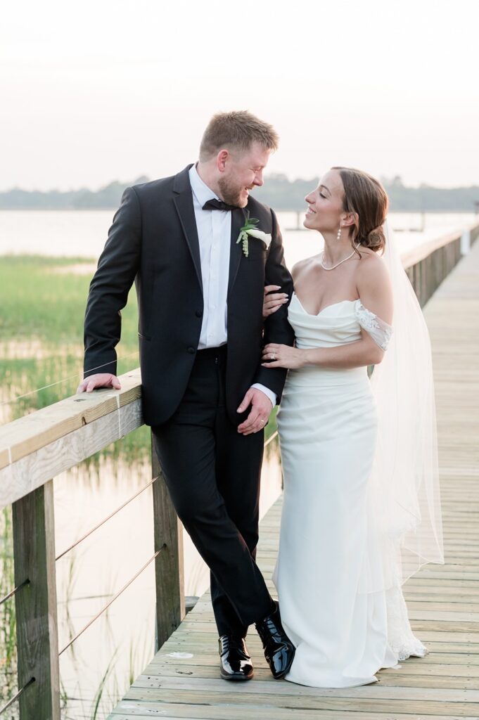 Bride and groom at sunset on the dock at Lowndes Grove Charleston SC