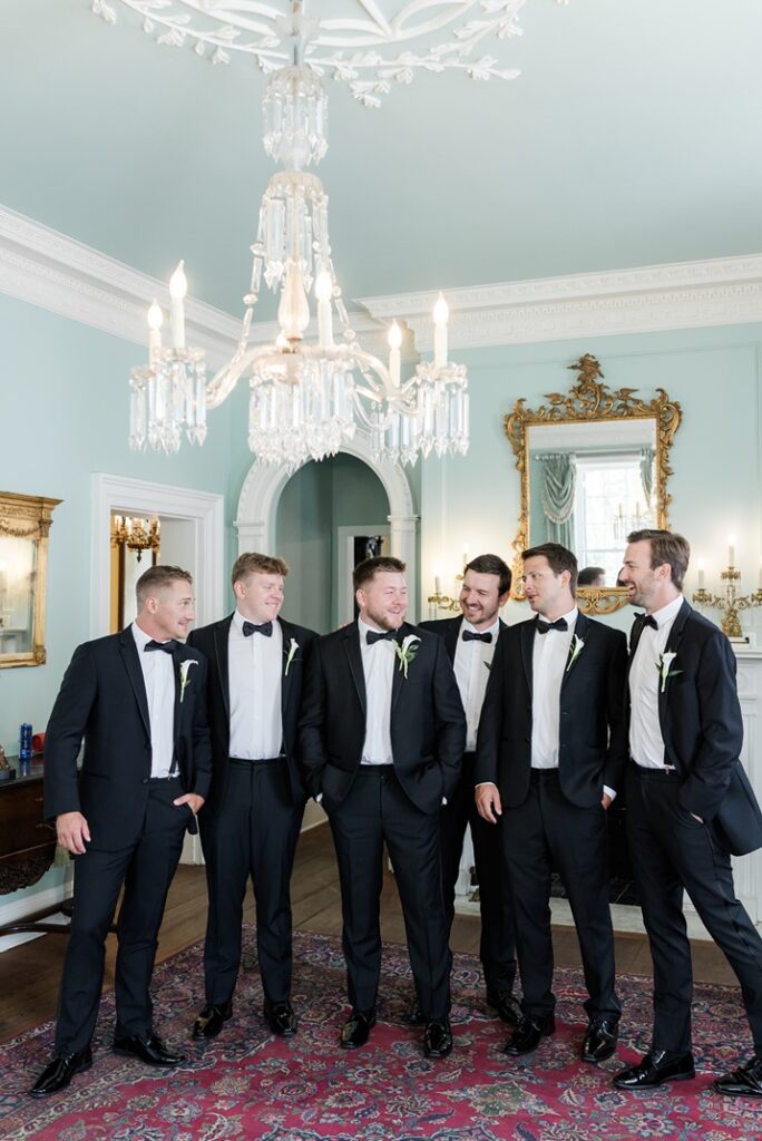 groom with groomsmen in green room at Lowndes Grove Wedding venue